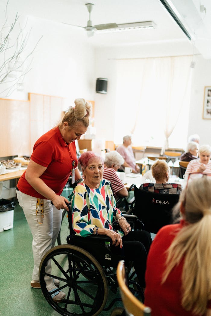 A caregiver assists a senior in a vibrant community center, promoting well-being.